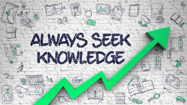 Always Seek Knowledge Drawn on White Brick Wall. 