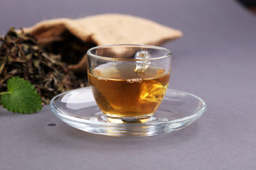 Herbal dry sri lanka tea. Mint leaf. Tea in a glass cup, mint leaves, dried tea, in a restaurant or teahouse