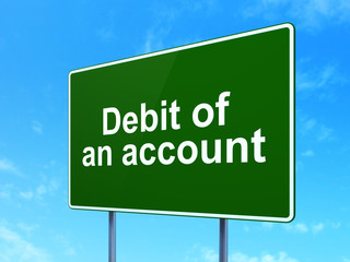 Money concept: Debit of An account on road sign background