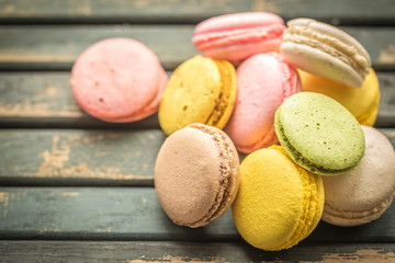 Colorful macaroons on wooden background