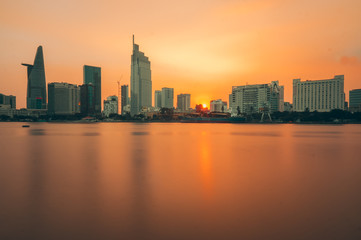 Fototapeta na wymiar Ho Chi Minh city, Vietnam - March 06, 2017: Colorful sunset on Sai Gon river