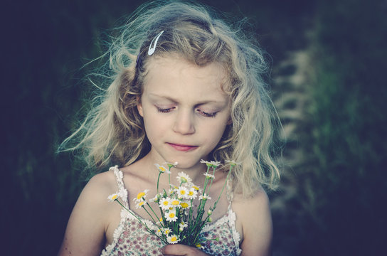 Child Smelling Herbs