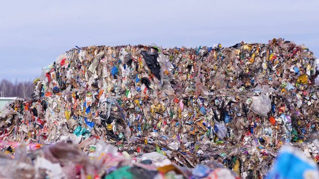 Lots of plastic, waste garbage at landfillsite. Urban refuse dump. 4K.