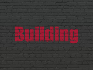 Fototapeta premium Constructing concept: Building on wall background
