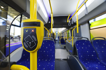 Validator, modern prepaid ticketing system with validation machine, fare in public city transport such as bus, tram, trolley, train, selective focus - 140538915
