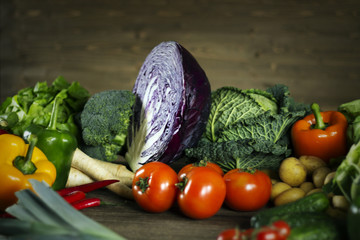 Young spring vegetables on  wood. Background layout with free text space.