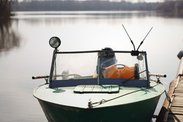 Obraz na płótnie Canvas Lifeboat moored on a river pantone berth