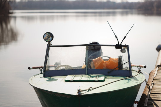 Lifeboat moored on a river pantone berth