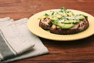 Open avocado sandwiches with tuna on whole grain bread