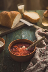 Ukrainian borsch with sour cream and bread