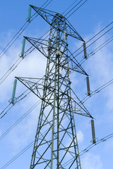 Electricity pylon against a cloudy sky