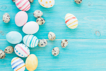 Colorful Easter Eggs on the rustic wooden background. Selective focus.