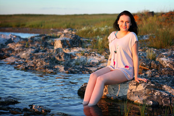 Young beautiful girl on nature