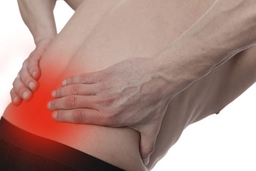 Muscular Man suffering from back pain. Incorrect sitting posture problems Muscle spasm, rheumatism. Pain relief, ,chiropractic concept. Sport exercising injury