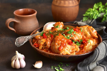 Chakhokhbili - chiken stew with garlic and cilantro (parsley) in tomato sauce.