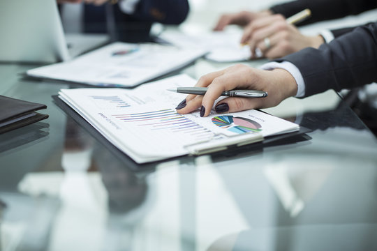 business team discussing financial charts on a workplace