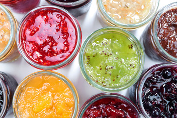 Mix of jams in jars. Homemade fruit jams