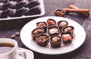 Coffee with assortment of chocolate candies