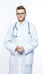 Fototapeta premium portrait - a family doctor with stethoscope on white background