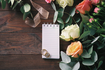 Wedding to do list with flowers on table