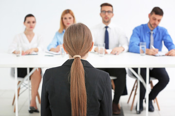 Job interview concept. Human resources commission interviewing woman