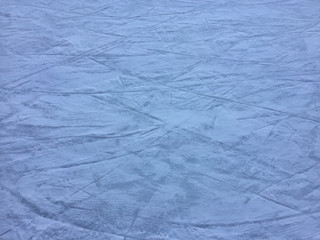 Ice scratches surface for texture or background, winter closeup top view image
