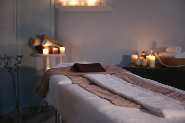Interior of modern massage room in candle light