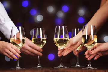People taking wine glasses at party, closeup