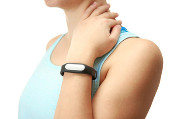 Woman using fitness tracker on white background