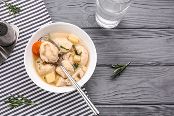 Portion of delicious chicken and dumplings on dining table