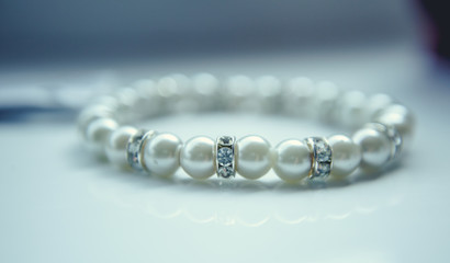 Pearl bracelet on white background. Freezer bags pearl necklace.