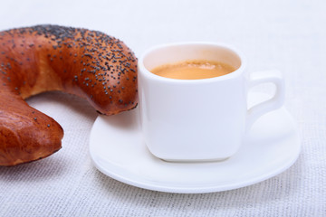 Fresh homemade muffin, cake and white cup of Cappuccino on white background.