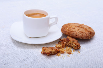Fresh homemade muffin, cake and white cup of Cappuccino on white background.