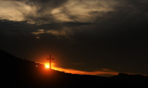 Cross at sunset on the hill
