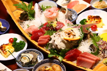 Sashimi boat (assortment of sashimi on a boat) with Japanese Traditional Food