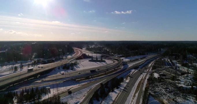 Keh&auml; 3 and e18 crossing, Cinema 4k aerial landing tilt view on route keha 3 and e18 crossing, just outside Espoo, in Uusimaa, Finland