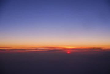 sunrise from horizon seen from air plane in the sky