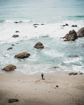Fisherman fishing on the beach