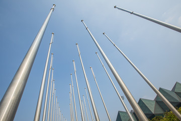 Obraz premium Row of flagpole in empty square,Tianjin,China.