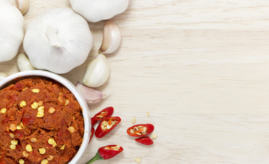 garlic and curry paste on the wooden background