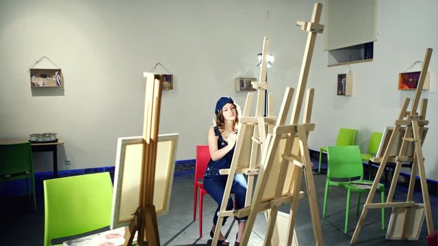 Young girl artist in art school
