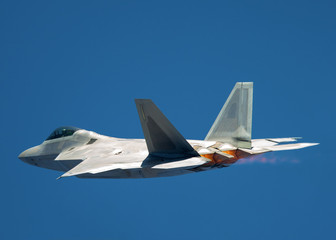 F-22 Raptor in a very unusual close view, with afterburners on