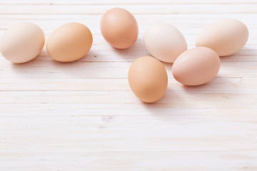 eggs on white wooden background
