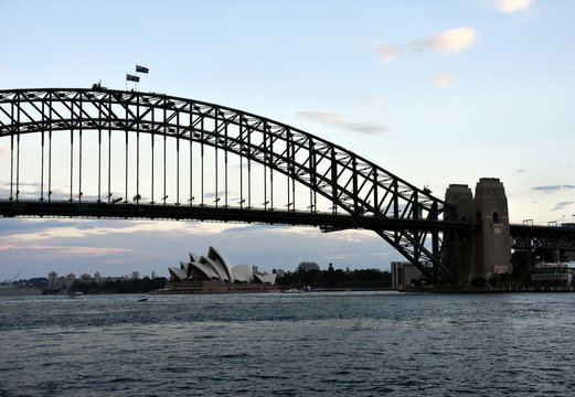Sydney, Australia - Feb 5, 2017. Opera House and Harbour Bridge from Milsons Point Ferry Wharf at Sunset.
