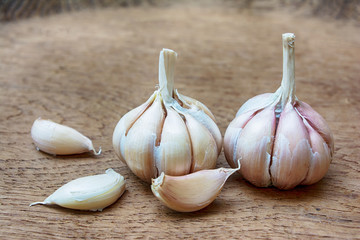 Garlic on wooden vintage background.