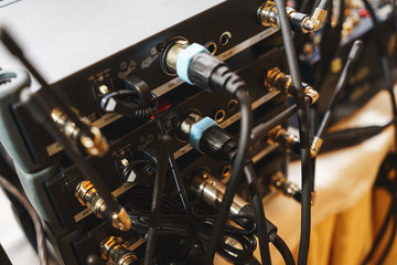 The back panel of special audio equipment for connecting audio cables.