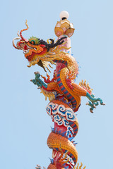 Chinese style dragon statue in blue sky