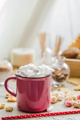 a delicious Cup of cocoa with marshmallows and straws