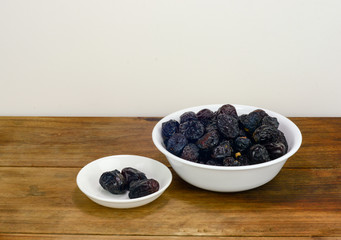 Dates and milk for Ramadhan breaking fast on wooden surface