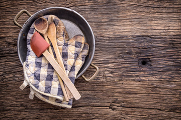 Top of view on Vintage kitchen utensils on rustic wood background.